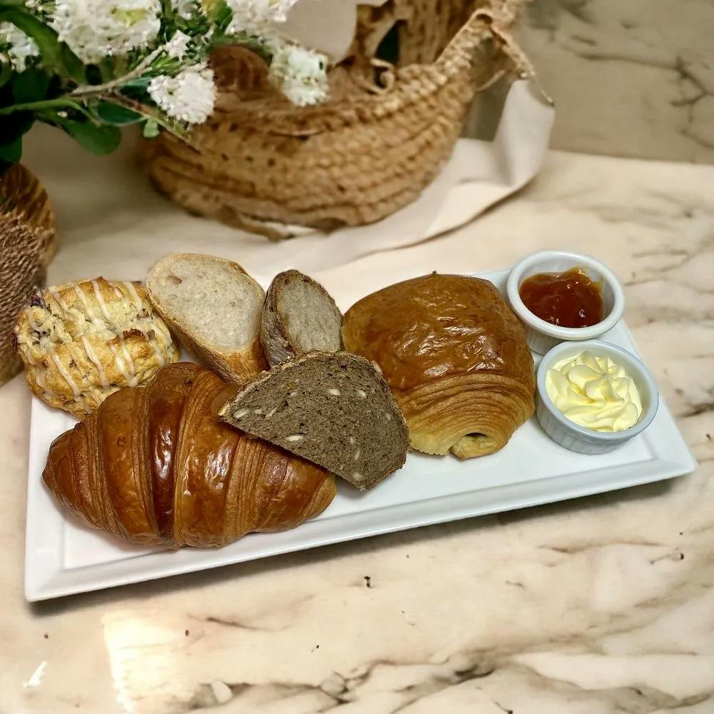 A plate of bread and Croissant from Oh La La French Bakery